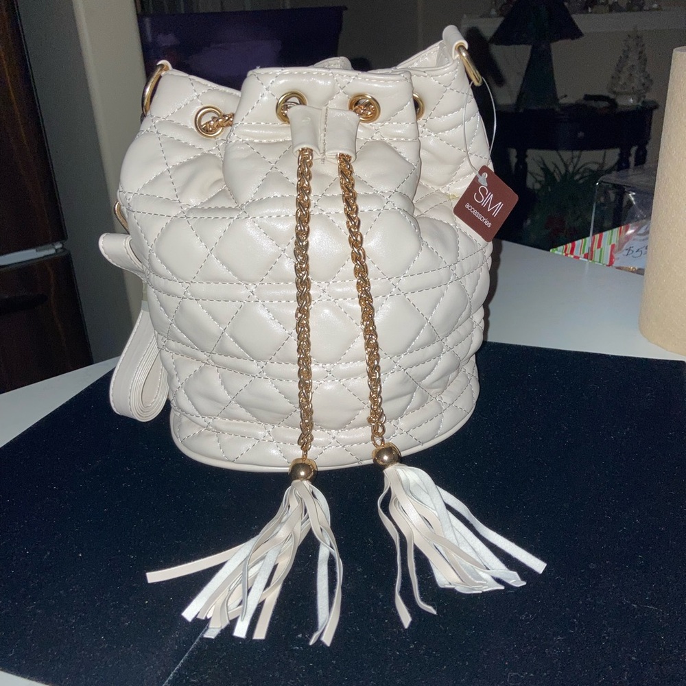 Quilted Mini Satchel Cream vegan leather. Gold-tone accents with a Tassel pull